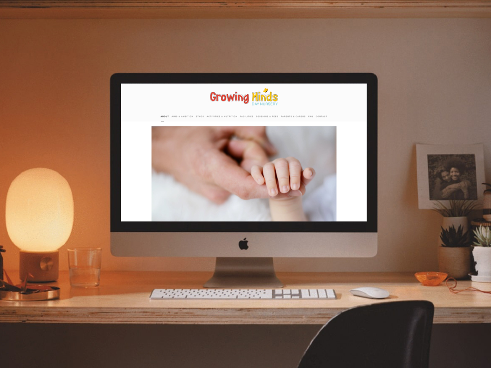 iMac computer shows Growing Minds website design